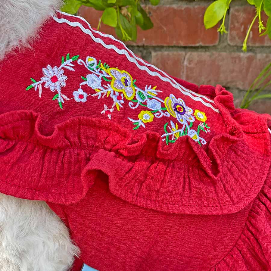 Detailed view of the Embroidered Traditional Mexican Fiesta Dog Dress available in rojo from online dog clothing store they made me wear it. 