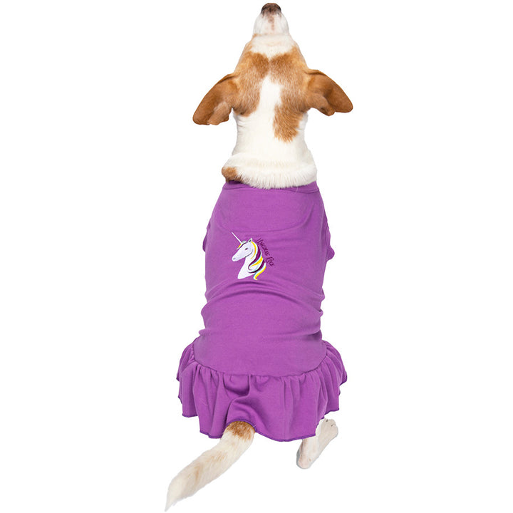 Jack Russell / Rat Terrier sitting down showing off the back of the Embroidered Unicorn Dog Dress in Violet from online posh puppy boutique they made me wear it.
