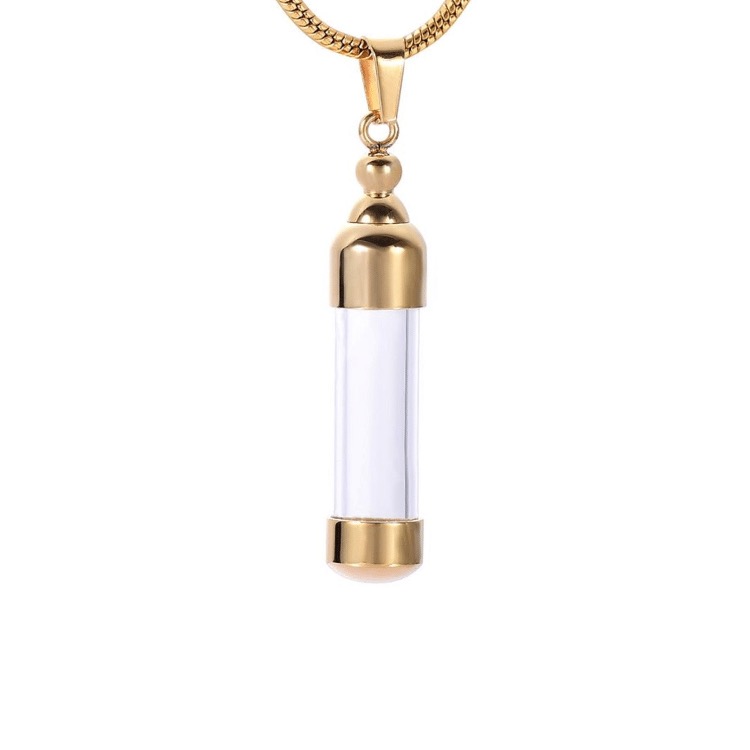 Delicate Gold Capsule Cremation Necklace to memorialize your loved ones forever. Personalized bereavement gifts for family and friends who want a vial to hold a small amount of ashes to remember the loved ones they've lost. Free engraving available from online store they made me wear it.