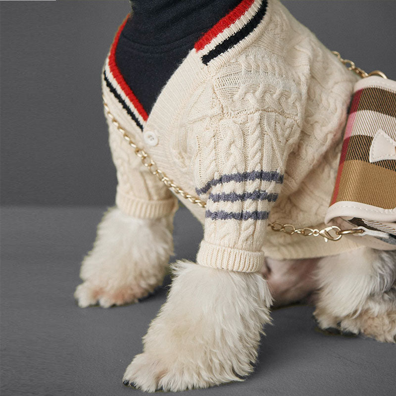 Detail shot of the Preppy Cable-Knit Dog Cardigan in Cream from online dog clothing store they made me wear it.