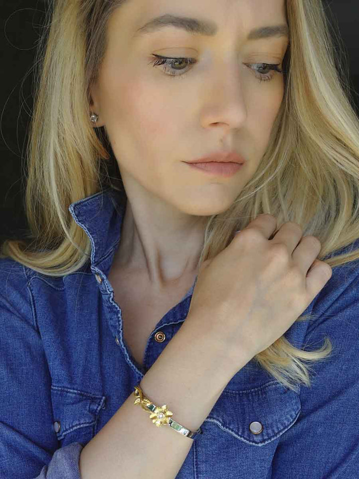 Woman wearing the beautiful Sunflower Memorial Bracelet in Stainless Steel from online boutique they made me wear it. The perfect gift to hold ashes of your loved ones and cherish their memory. Free engraving.