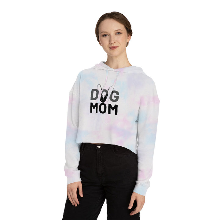 Young woman wearing the Tie-Dye Dog Mom Cropped Hoodie from online outerwear and activewear clothing store for pet parents, they made me wear it.